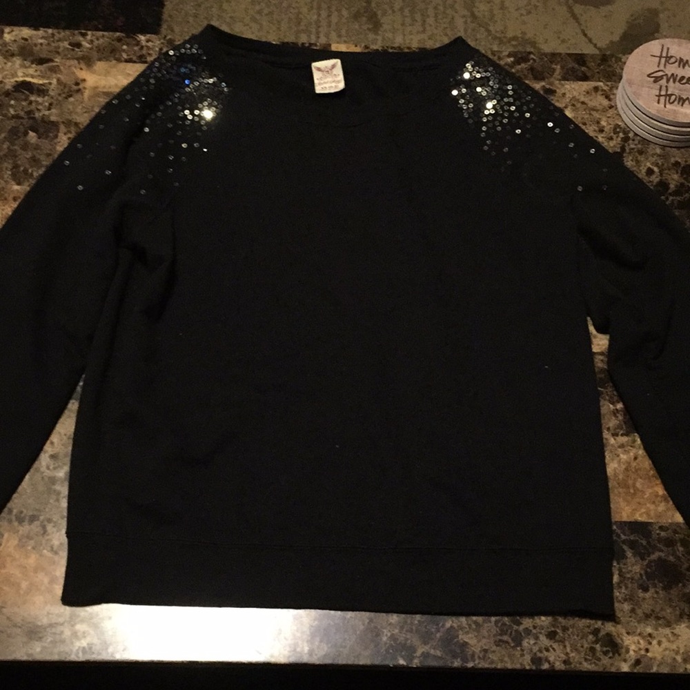 Black sweater with sequins on shoulders